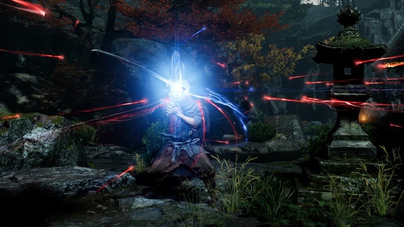 A burst of blue energy erupts as the protagonist counters an attack in a temple garden at night